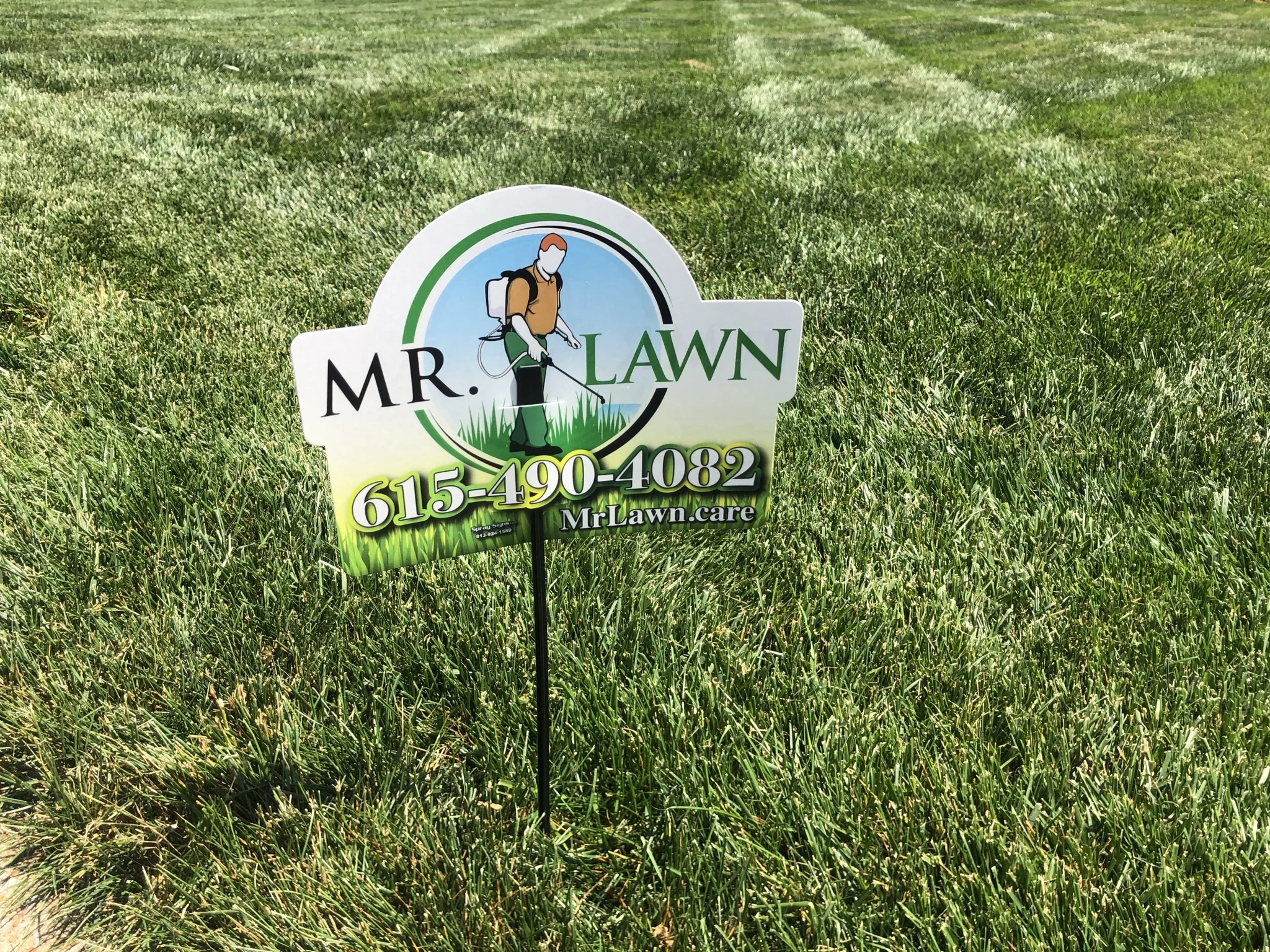 A Mr Lawn Care Sign in a Beautiful Fescue Lawn Close up — Mr. Lawn Care, Middle Tennessee lawn treatment