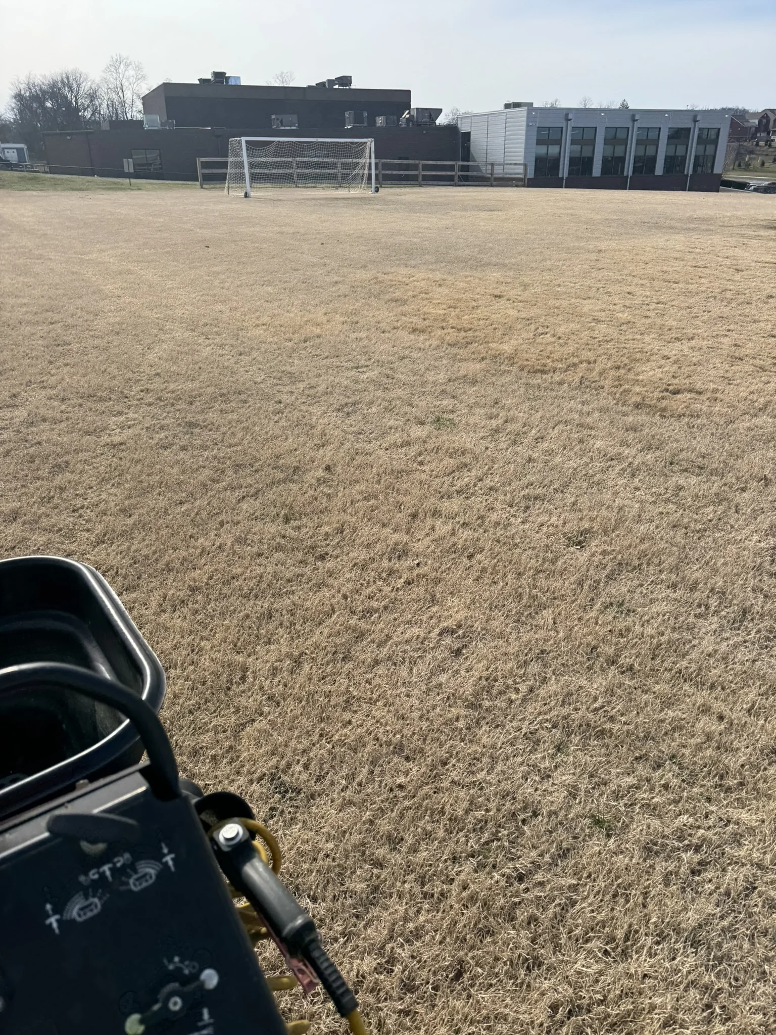 Lawn Care Applicator Spraying Dormant Brown Grass in Brentwood — Mr. Lawn Care, Middle Tennessee lawn treatment