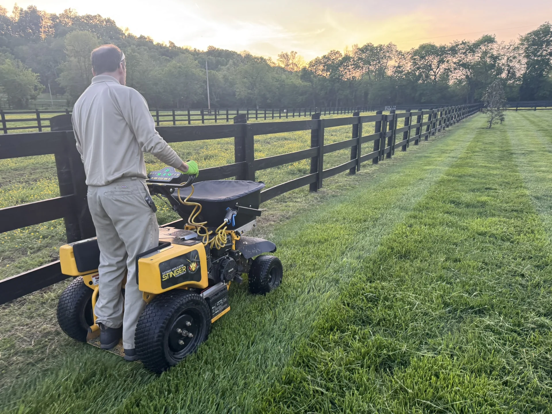 Our Horticulturist Applying a Treatment to a Beautiful Fescue Lawn in Culleoka a Nice Pasture on One Side and Fescue on the Other — Mr. Lawn Care, Middle Tennessee lawn treatment