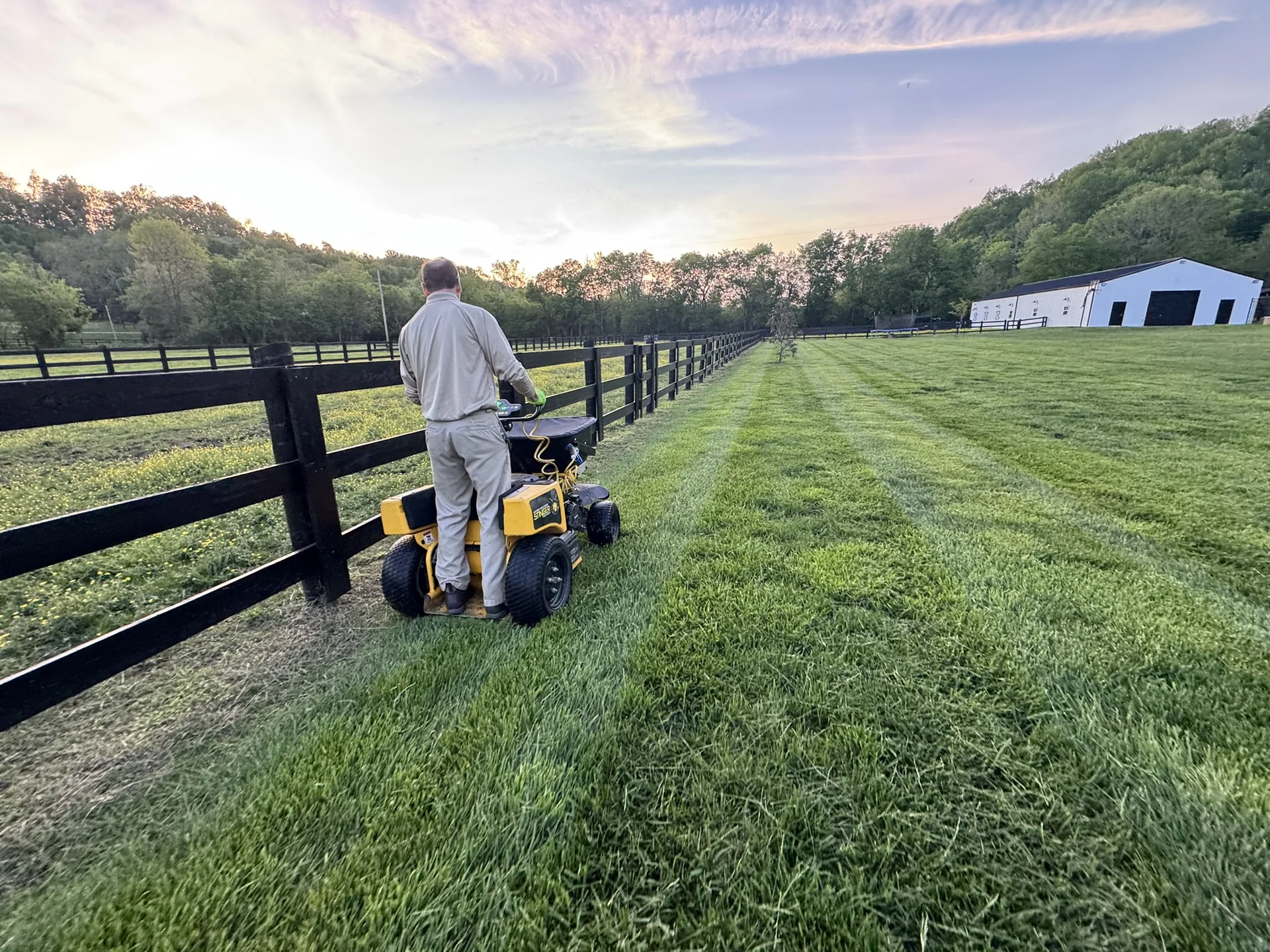 Our Horticulturist Applying a Treatment to a Beautiful Fescue Lawn in Culleoka a Nice Pasture on One Side and Fescue on the Other — Mr. Lawn Care, Middle Tennessee lawn treatment